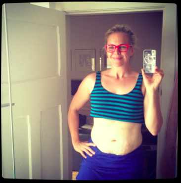 Taryn Brumfitt in a crop top Taryn Brumfitt sticking it to unrealistic magazine covers.